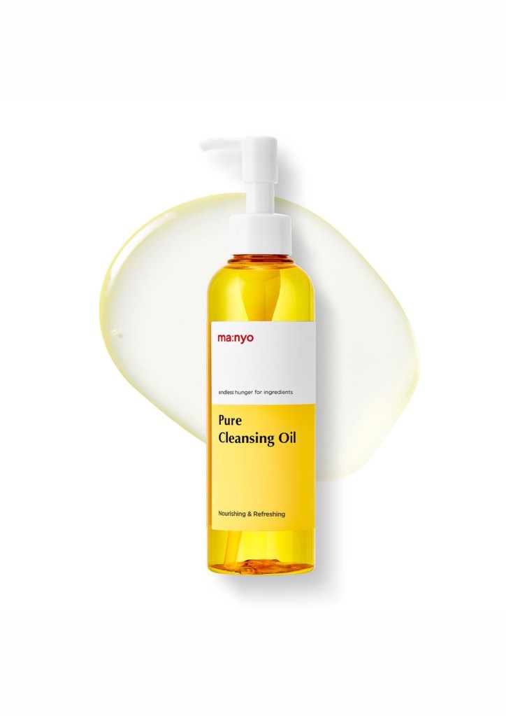 ma:nyo Pure Cleansing Oil in a golden yellow pump bottle on a white background.